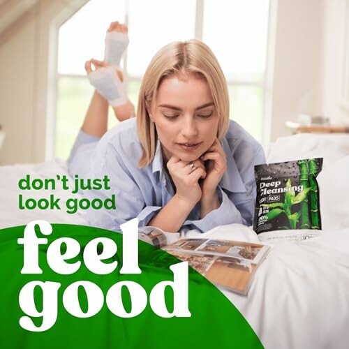 Woman reading a magazine on bed with skincare product nearby.